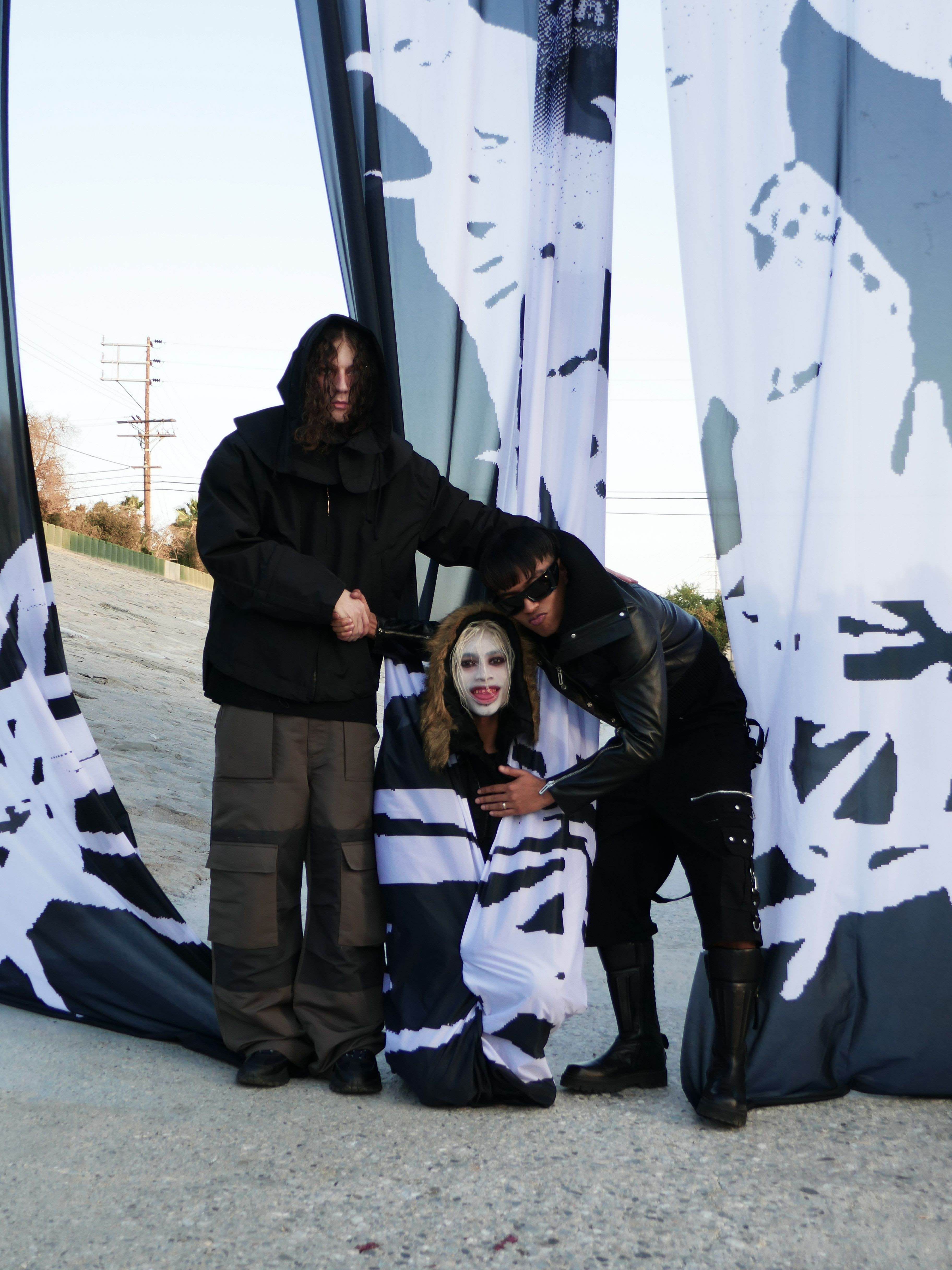 032c × Drain Gang — group photograph by a fence
