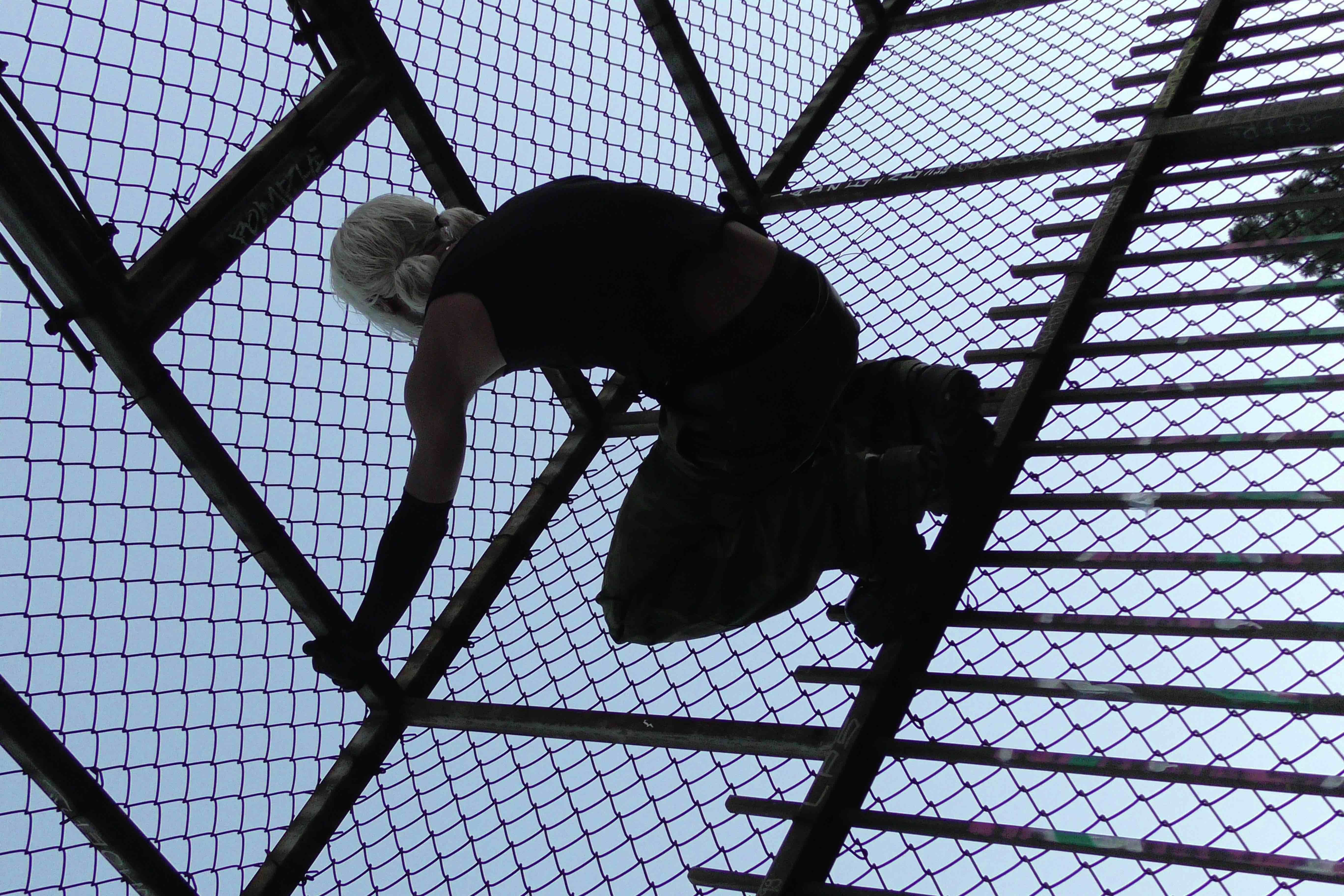 032c × Drain Gang — figure climbing a fence