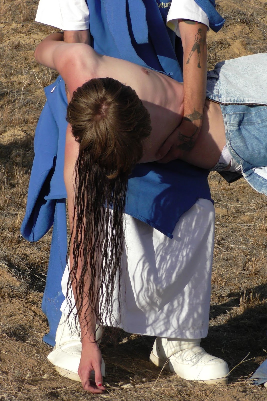 Hood By Air — Trust Exercise, figure bent over with long wet hair and a blue drape