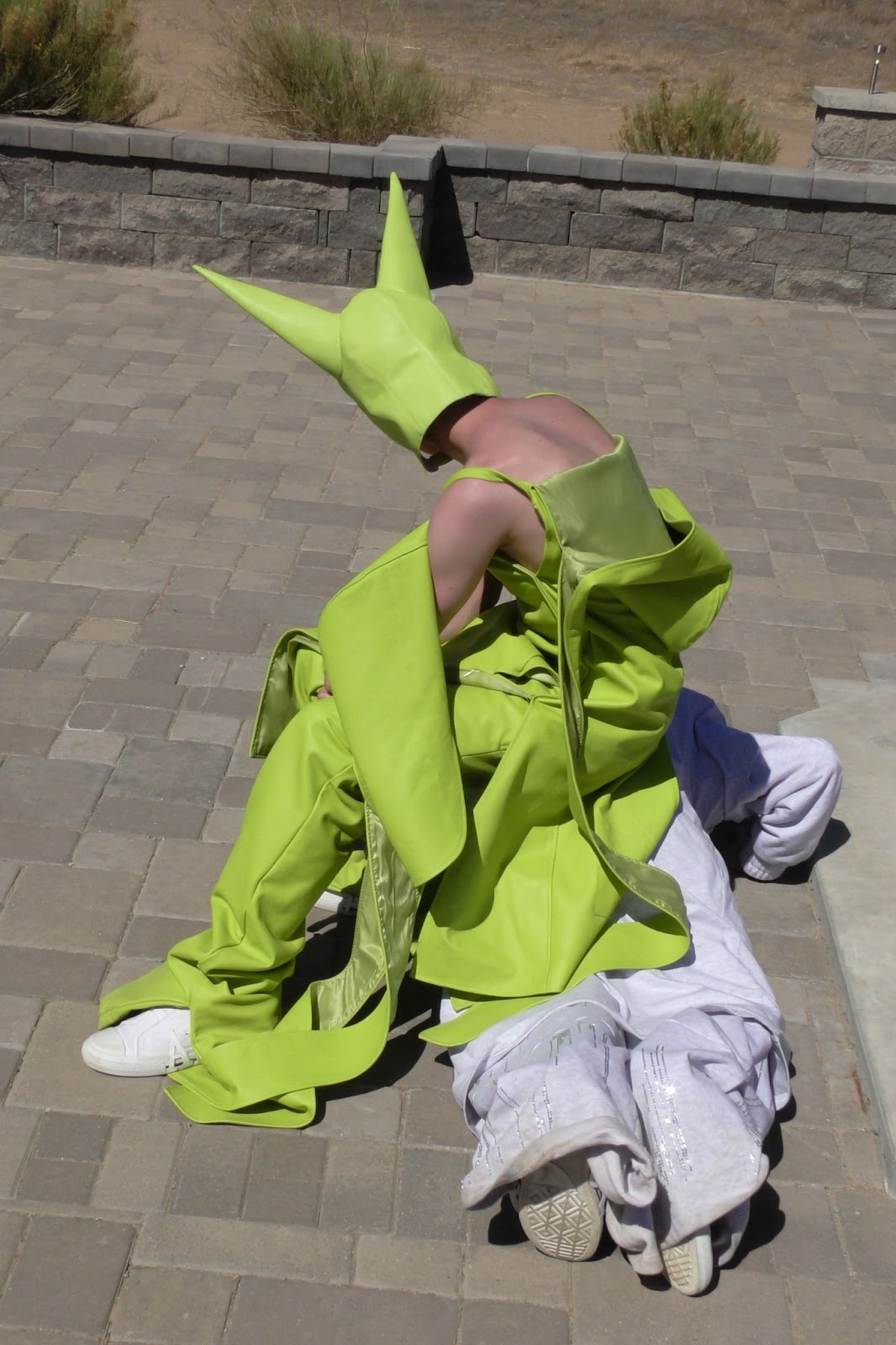 Hood By Air — Trust Exercise, two figures in acid green on the paving
