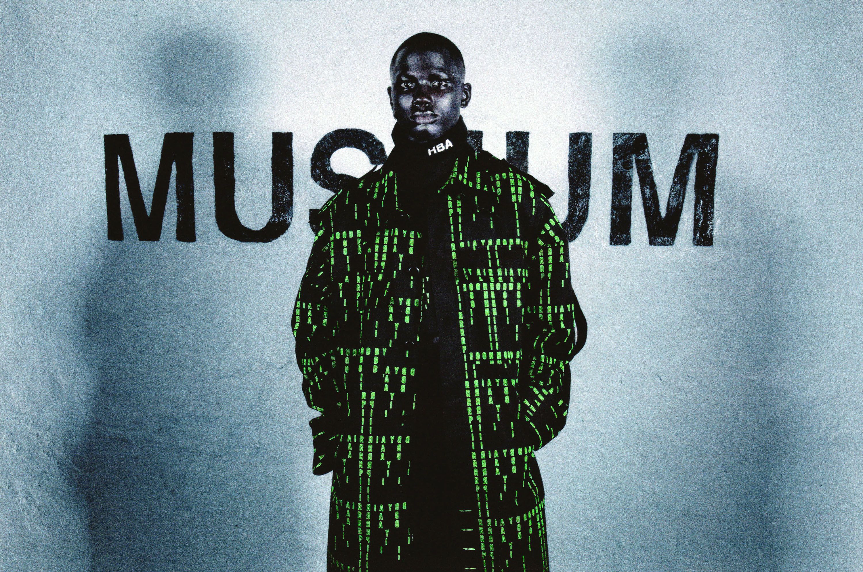 Hood By Air — Museum, model in a green-code coat facing the camera