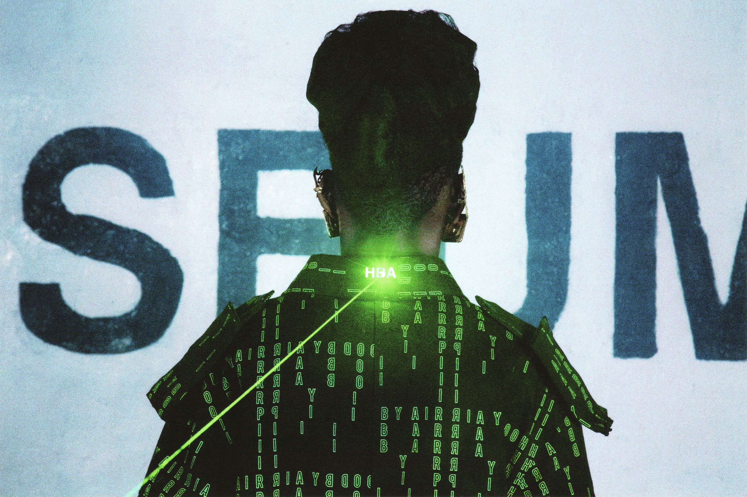 Hood By Air — Museum, back of the head and shoulders, a laser point at the neck