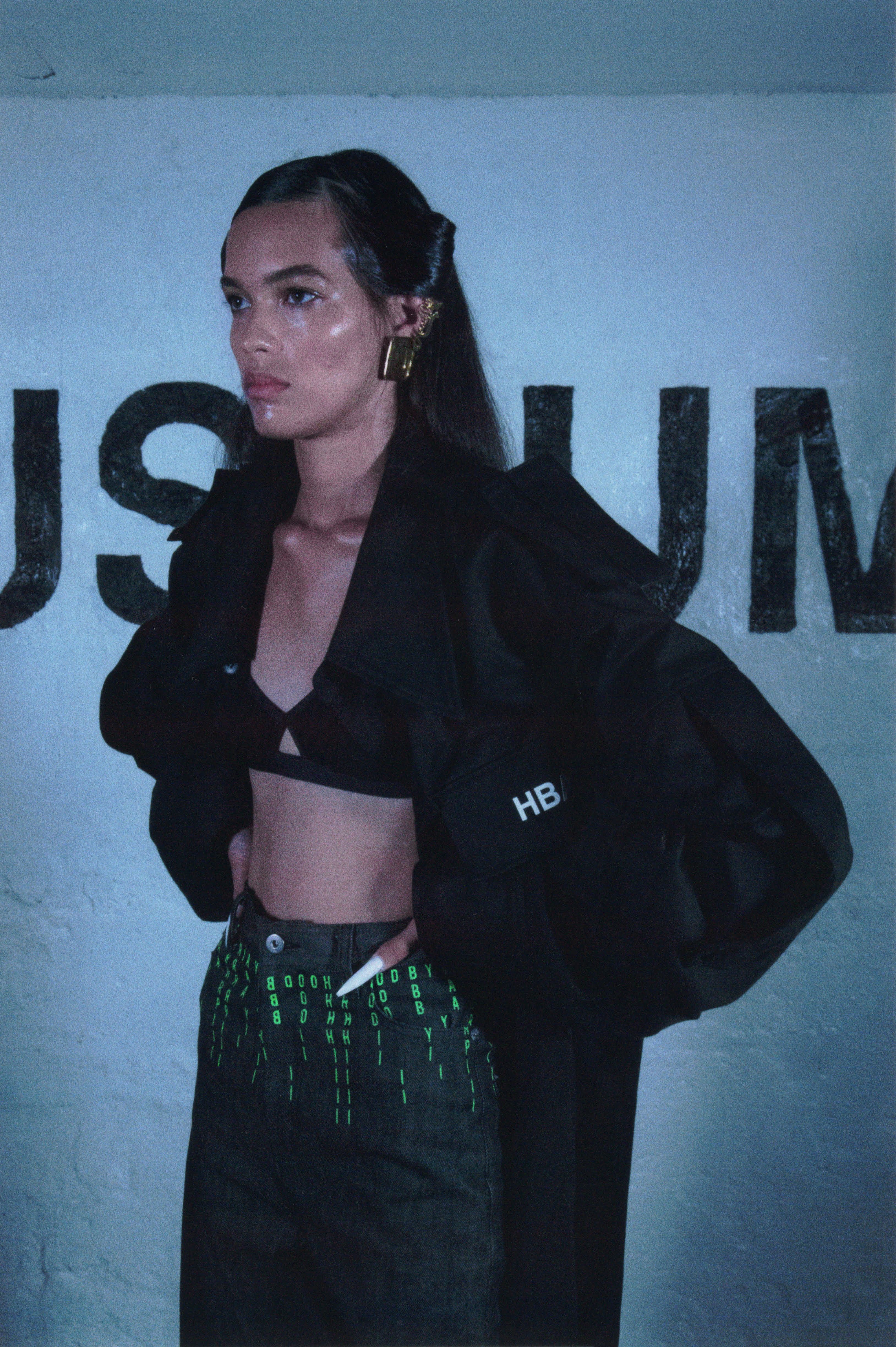 Hood By Air — Museum, portrait in a black jacket with an HB bag