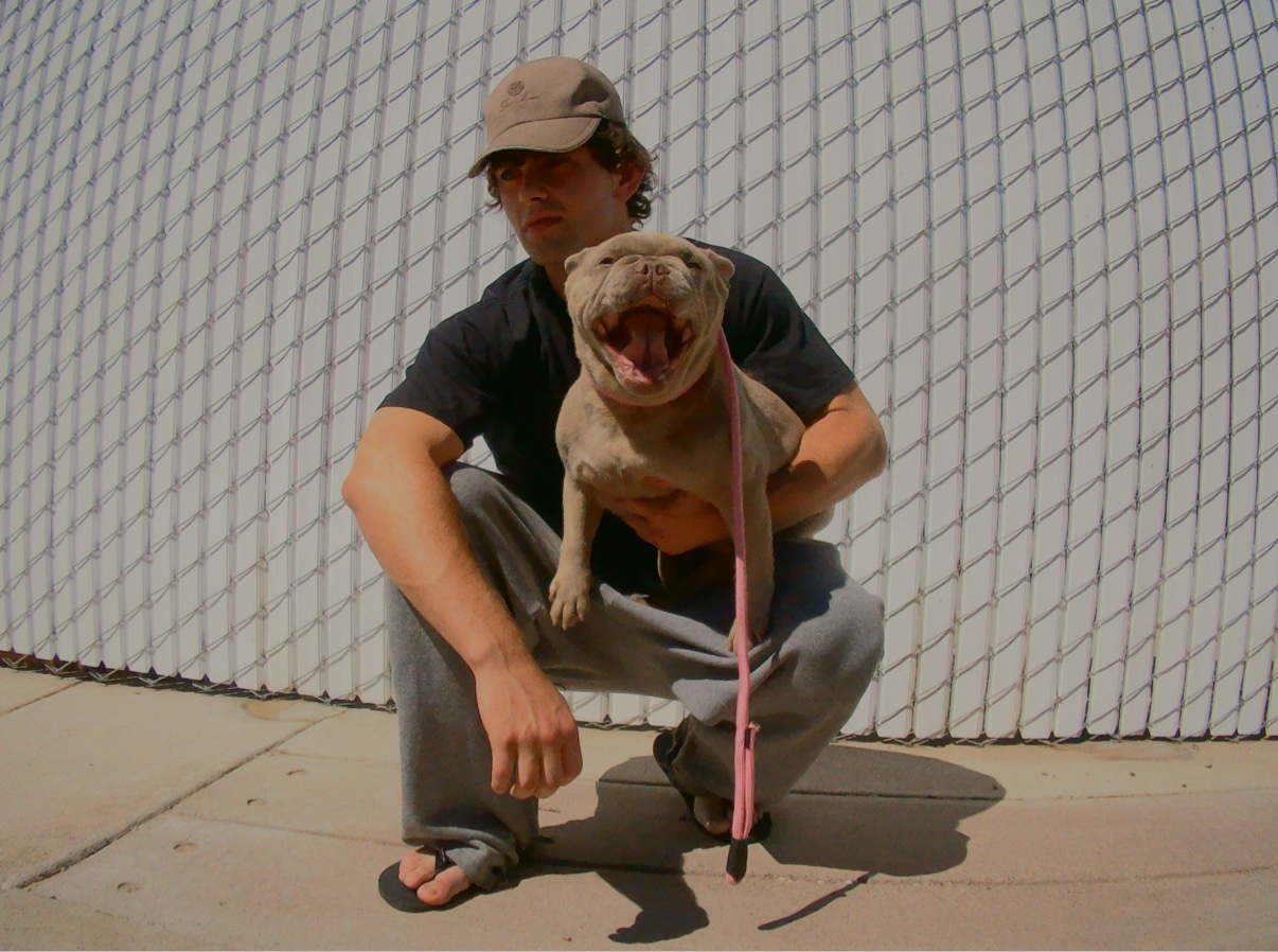Ian — crouching with a bulldog