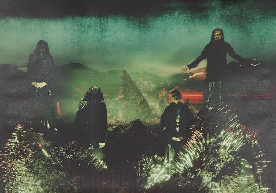 Korn — magazine spread, figures in a landscape