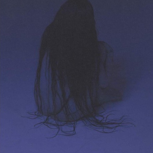 Noah Cyrus — portrait, hair over face in blue light