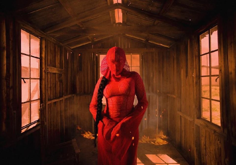 Noah Cyrus — figure in a cabin doorway