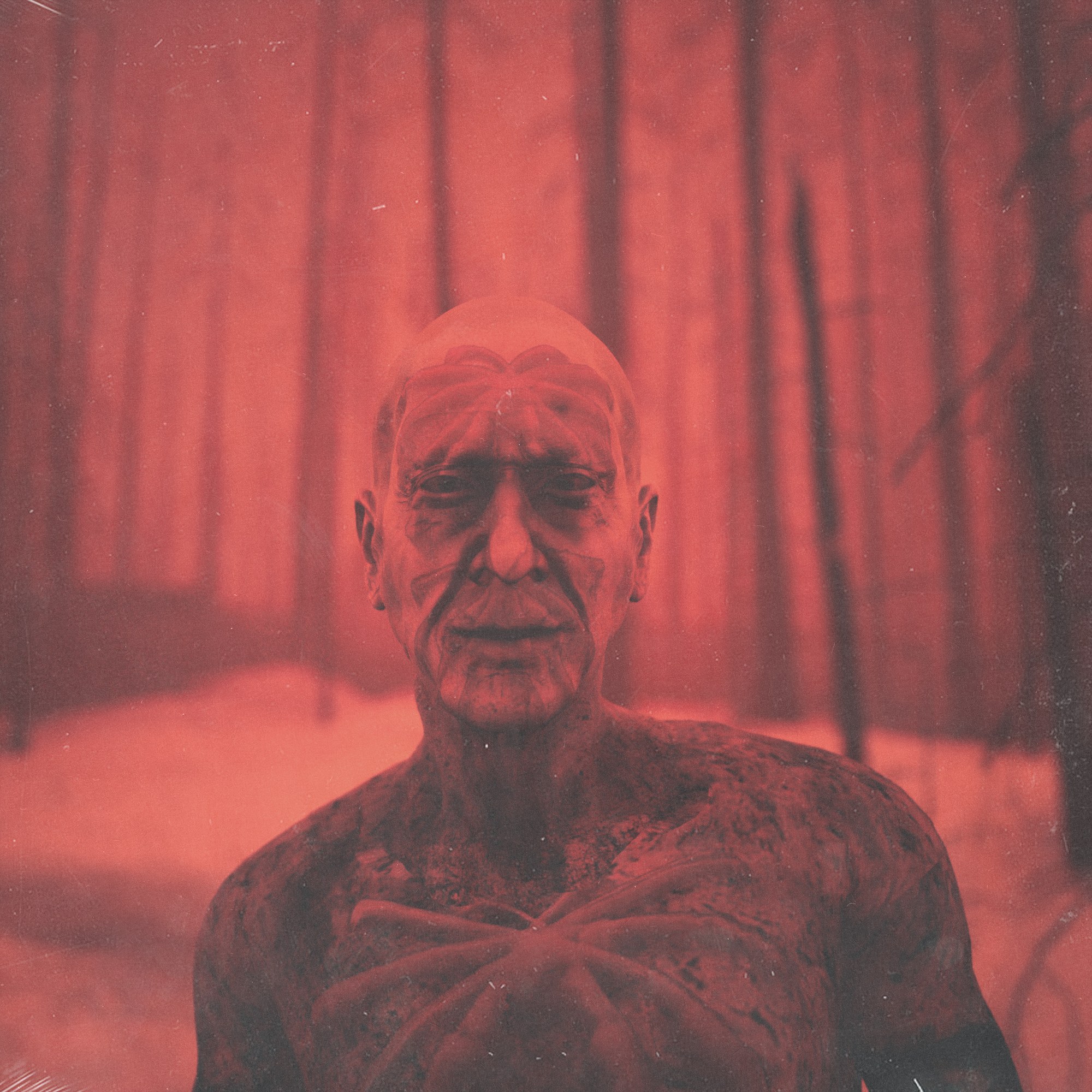 Shlohmo — Heaven Inc., campaign graphic, figure in a red forest