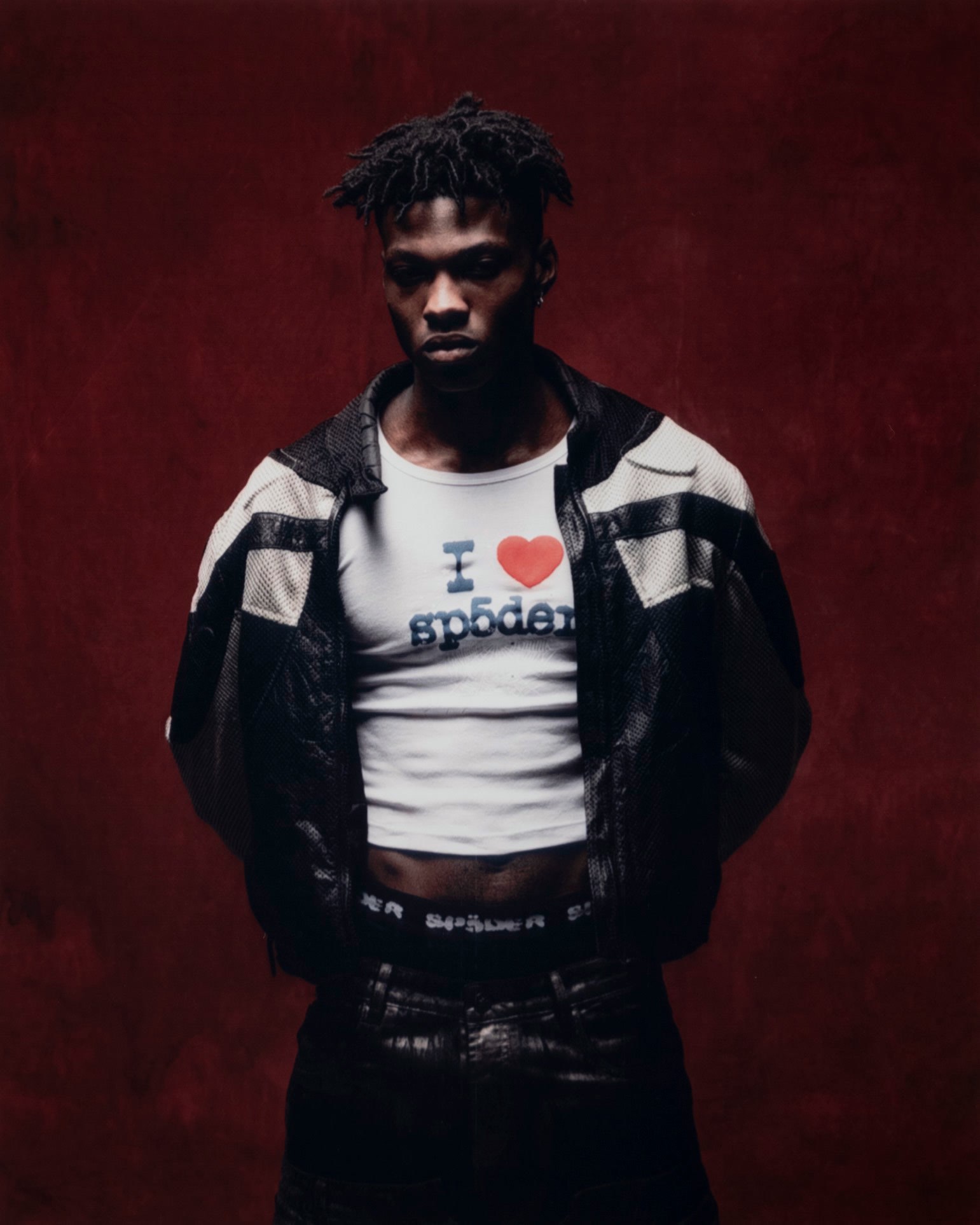 Sp5der — campaign photograph, portrait on red