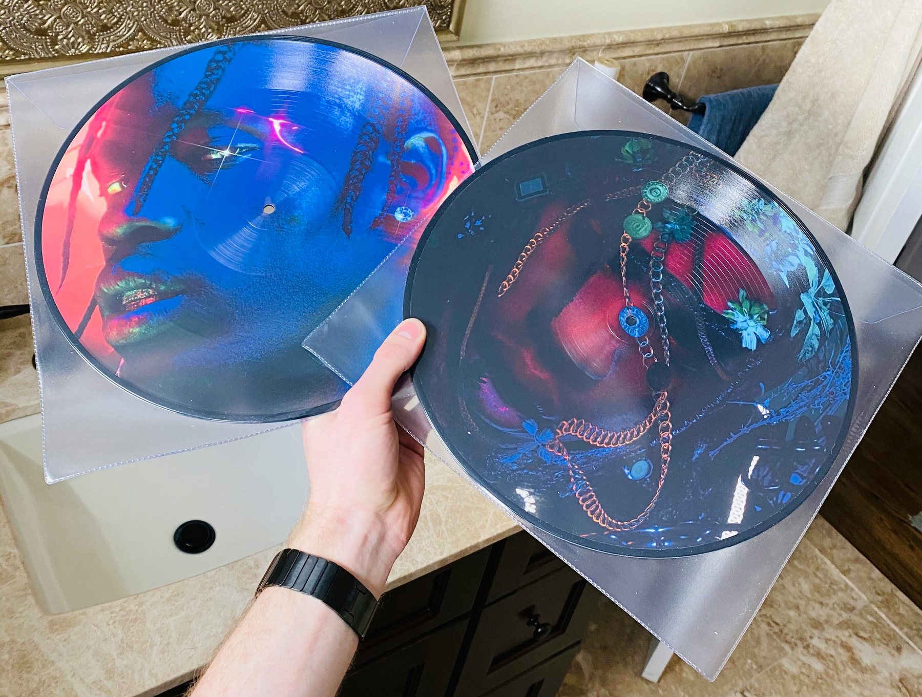 Travis Scott — picture discs held up
