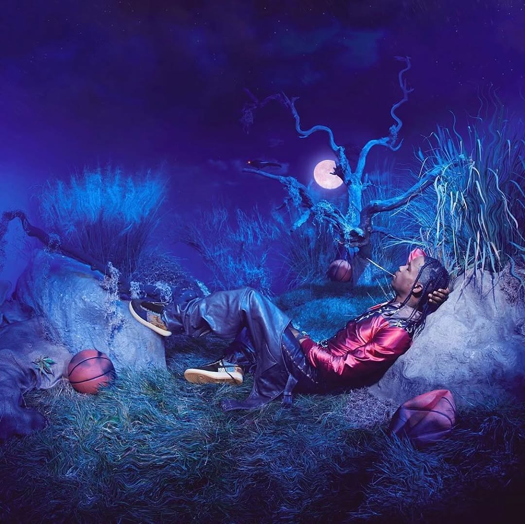 Travis Scott — reclining under the moon with basketballs