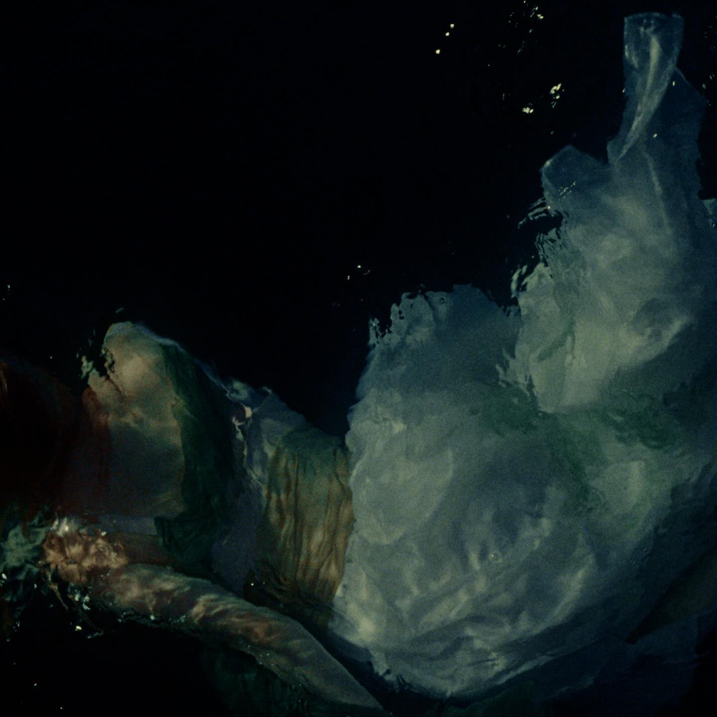 Wisp — Your Face, figure floating underwater in a white dress