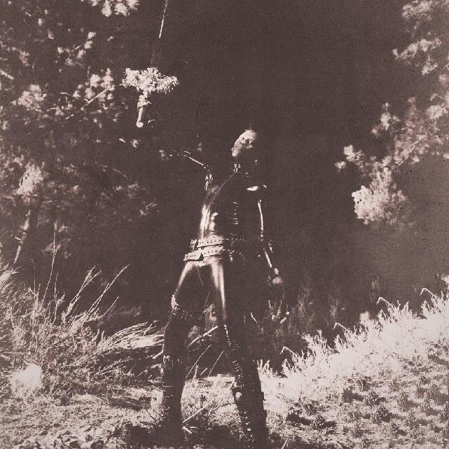 Yves Tumor — Jackie era photograph, holding a cross